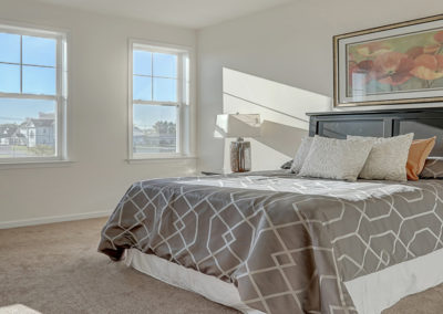 Bedroom with large windows at The Lofts at Worthington in Lancaster