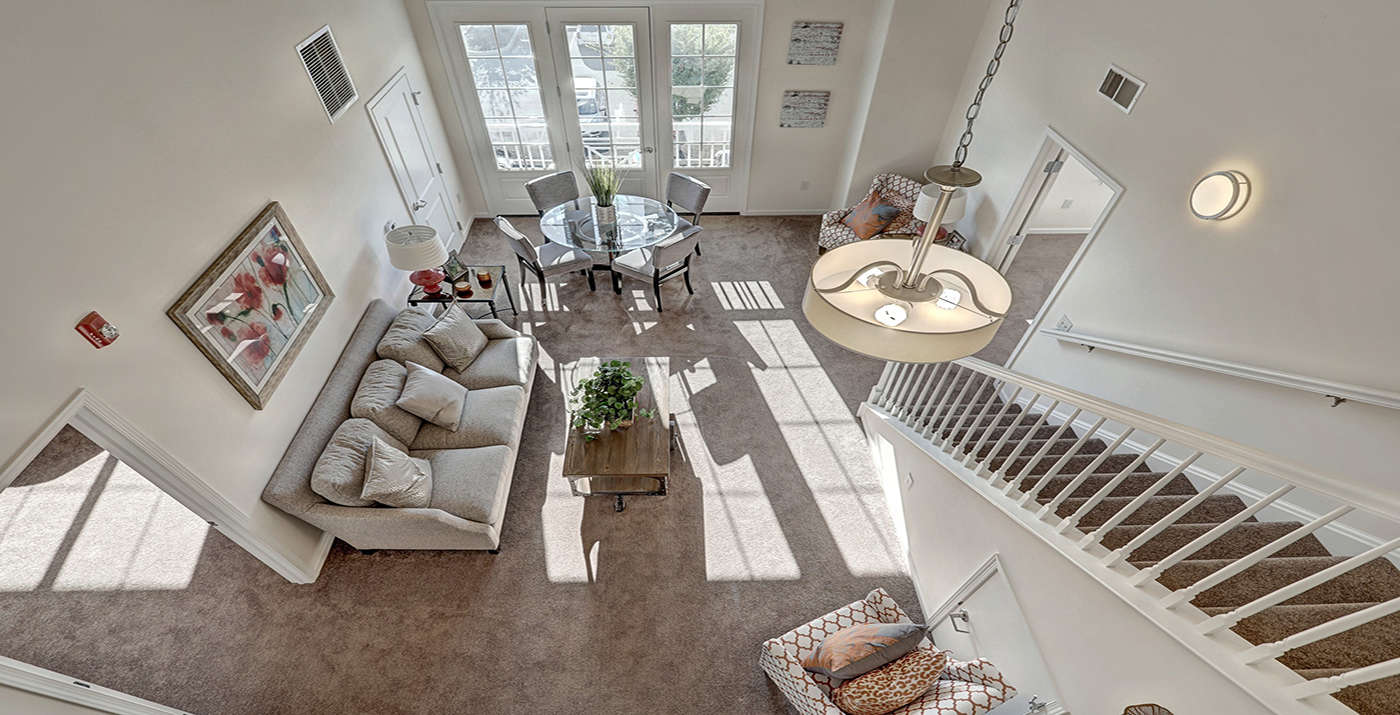 Arial view of the living room from the loft in a Lancaster apartment View from the top of a loft apartment at The Lofts at Worthington