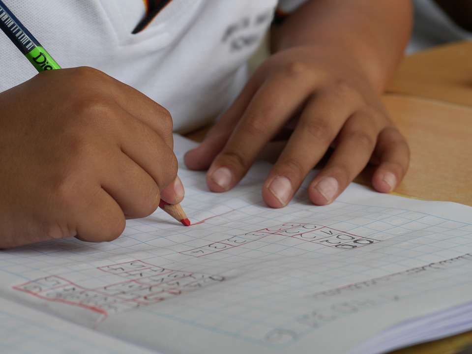 school-student-writing-math close up of a student writing math problems with a pencil